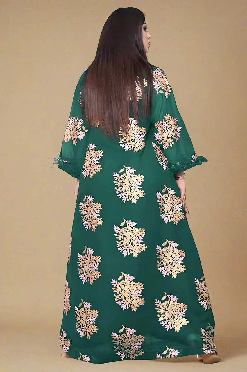 Studio back view of emerald green feather sleeve kaftan featuring repeated gold botanical motifs