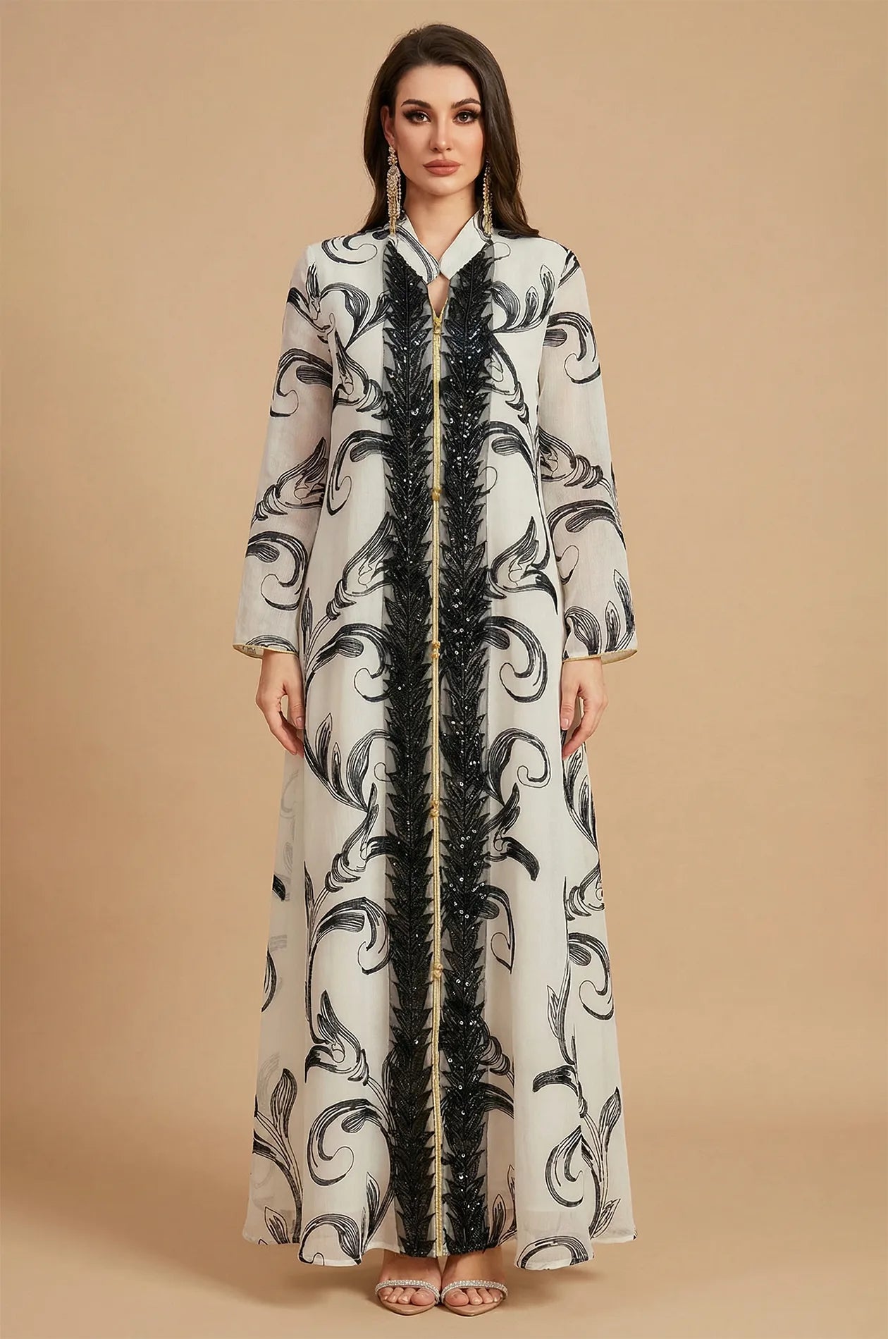 Full front view of Mylah white maxi kaftan with black beaded trim.