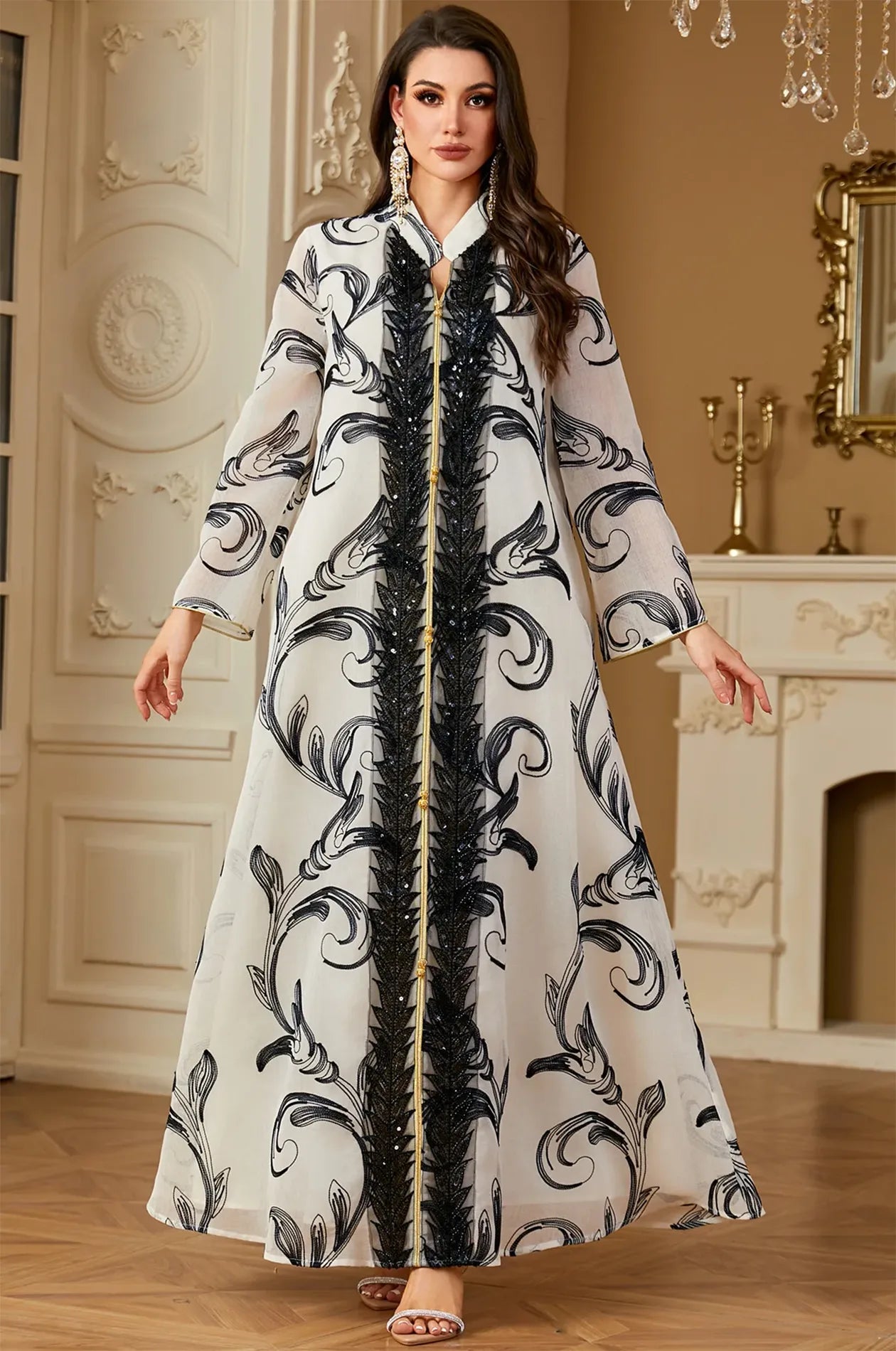 Fashion model wearing the Mylah maxi kaftan white in a luxury interior.
