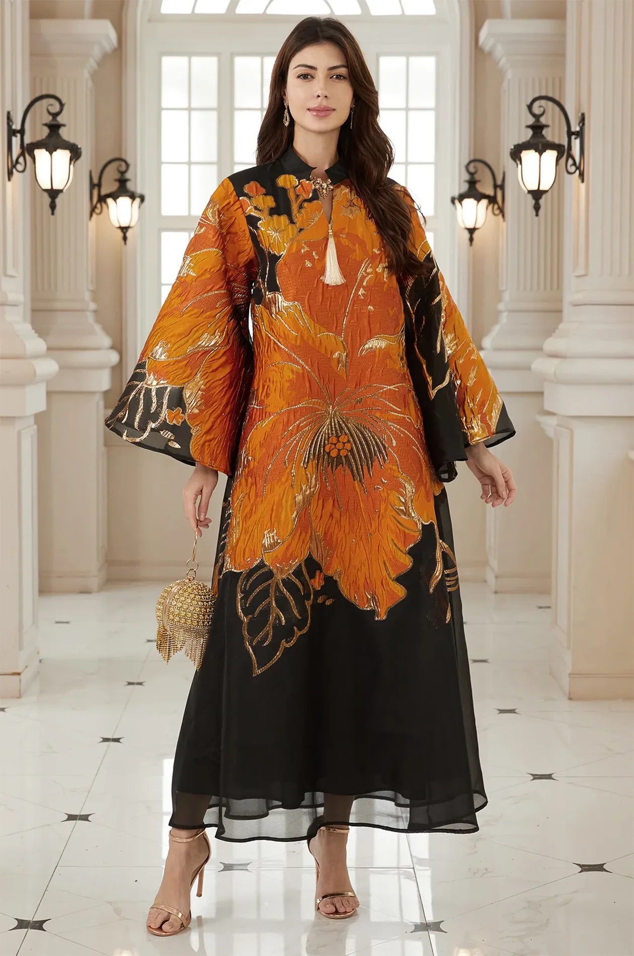 High-fashion frontal pose of the Naeli Orange Flowy Kaftan with bold black contrast and a sheer layered hemline.