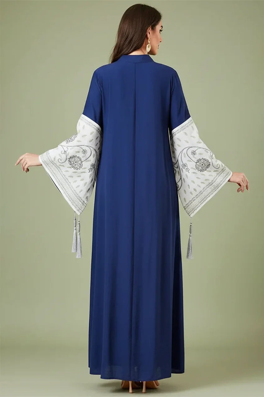 Back view of the Naylara Nairi navy blue cotton kaftan maxi showing the embroidered pattern on the wide bell sleeves