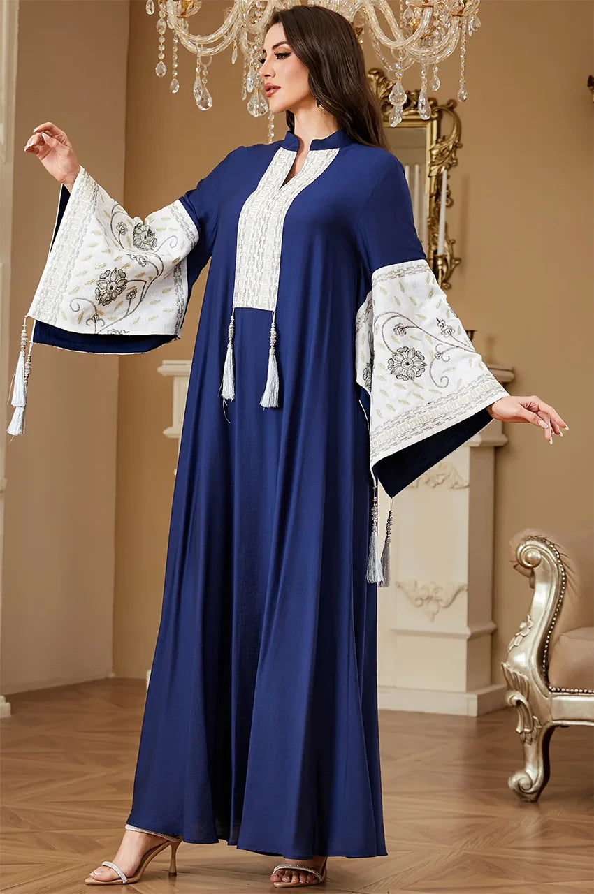 Dynamic pose showcasing the flow and breathable cotton fabric of the Navy Blue Nairi kaftan maxi by Naylara