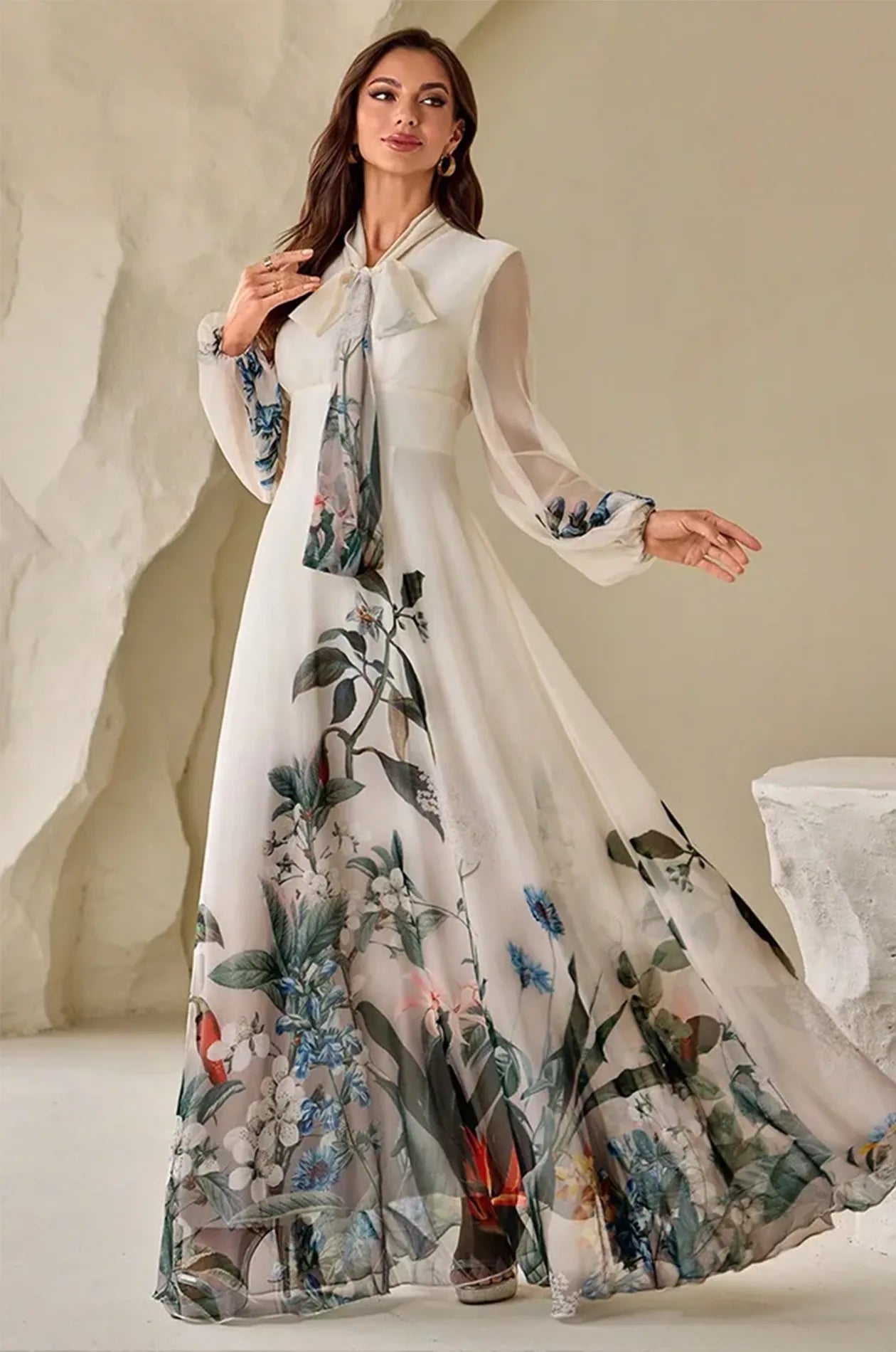 Elegant full-length pose of the Arina cream kaftan against a neutral backdrop.