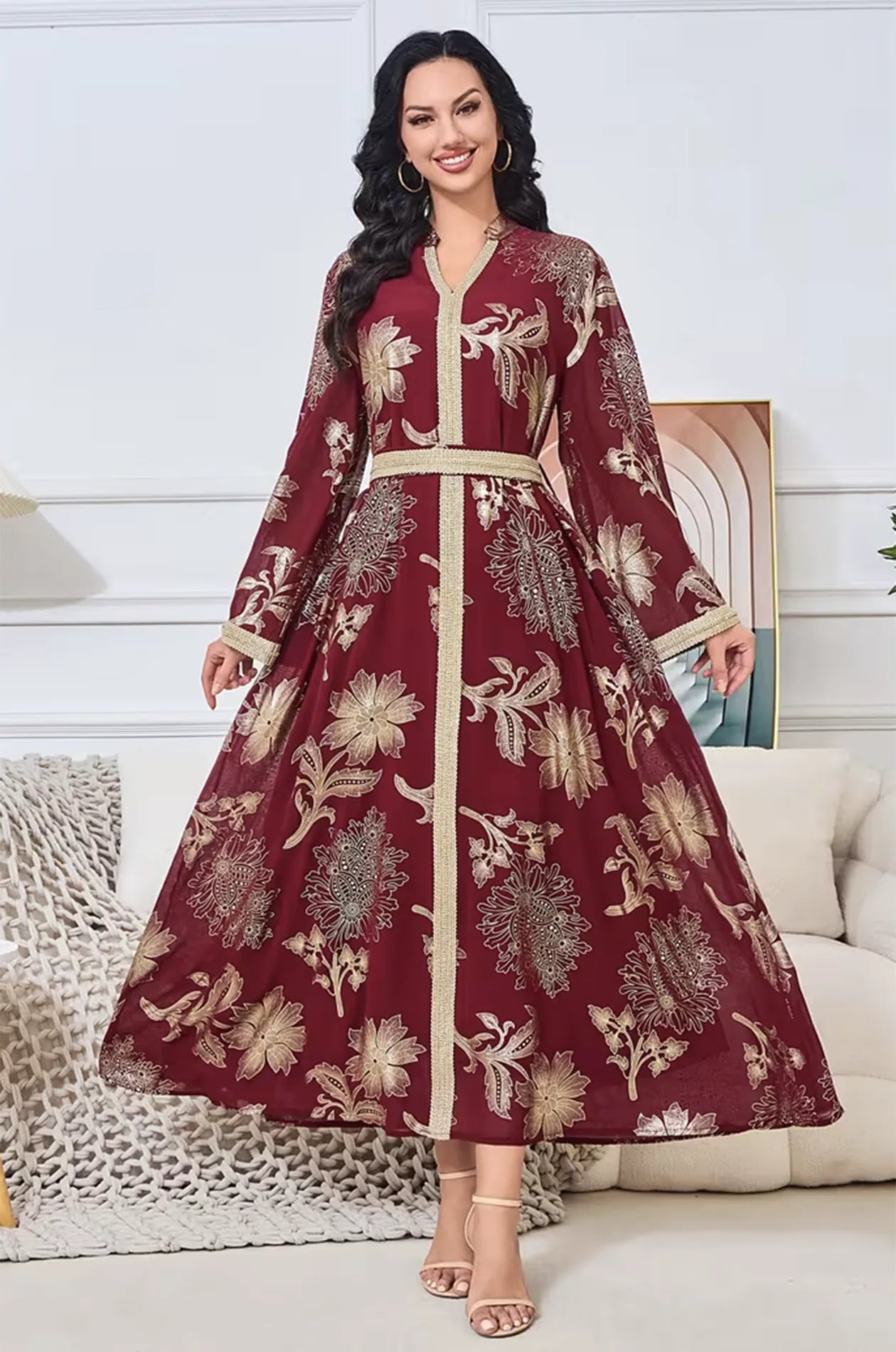 Model wearing the maroon Ayrah floral kaftan in a luxury home setting.