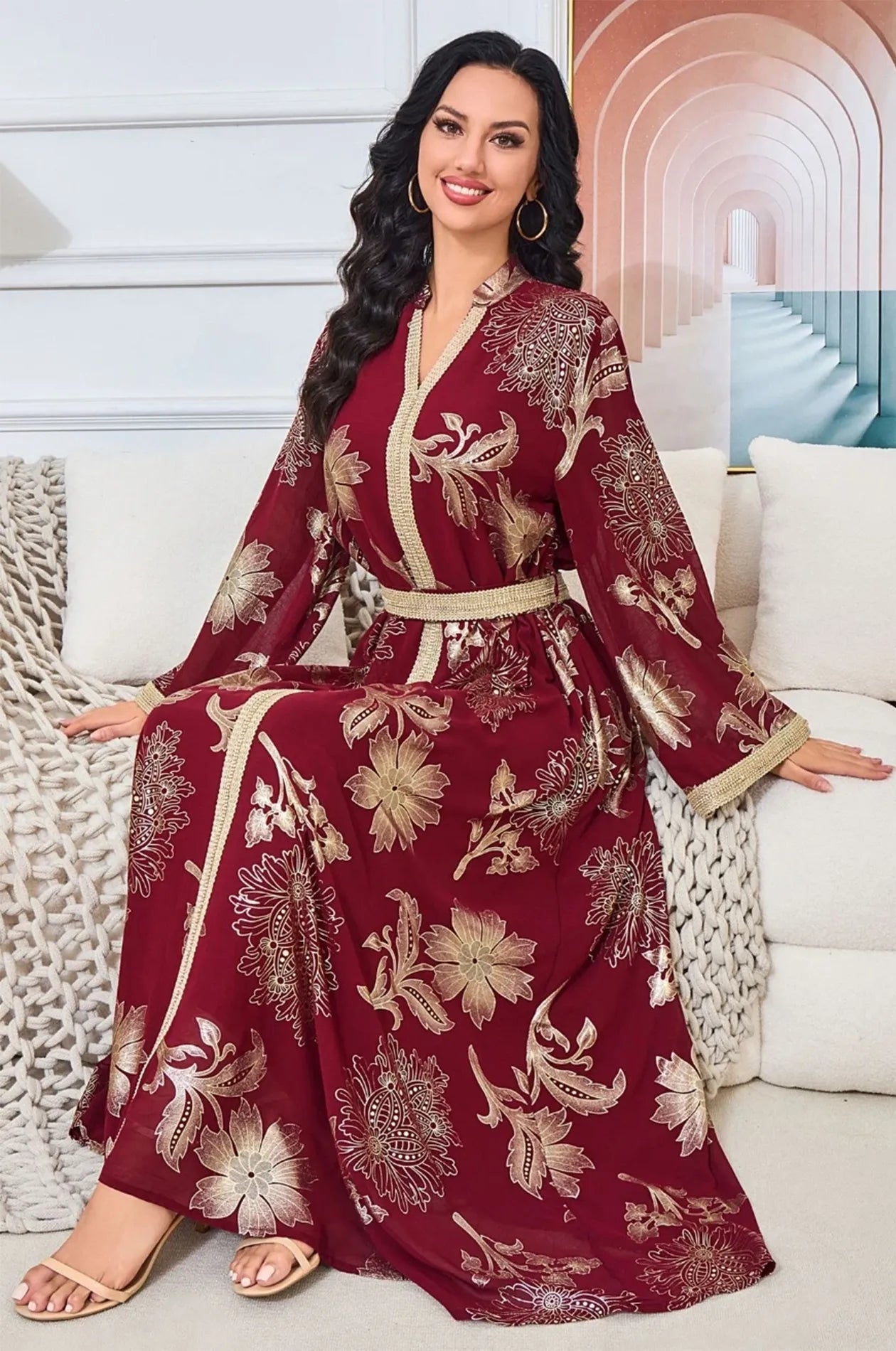 Seated view of the Ayrah maroon floral kaftan highlighting the skirt volume.