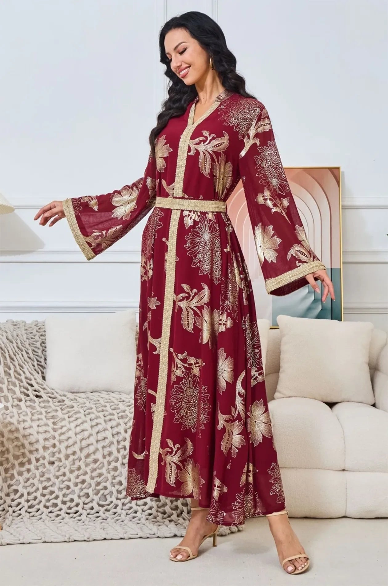 Dynamic shot of the Ayrah maroon kaftan showing the flow of the fabric.