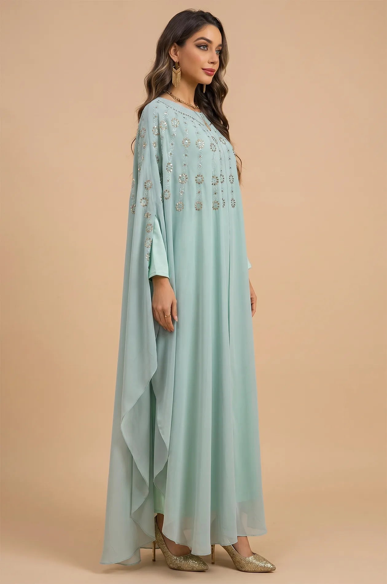 Side profile of the Cassia Light Green Rhinestone Kaftan highlighting the flowing butterfly sleeves.
