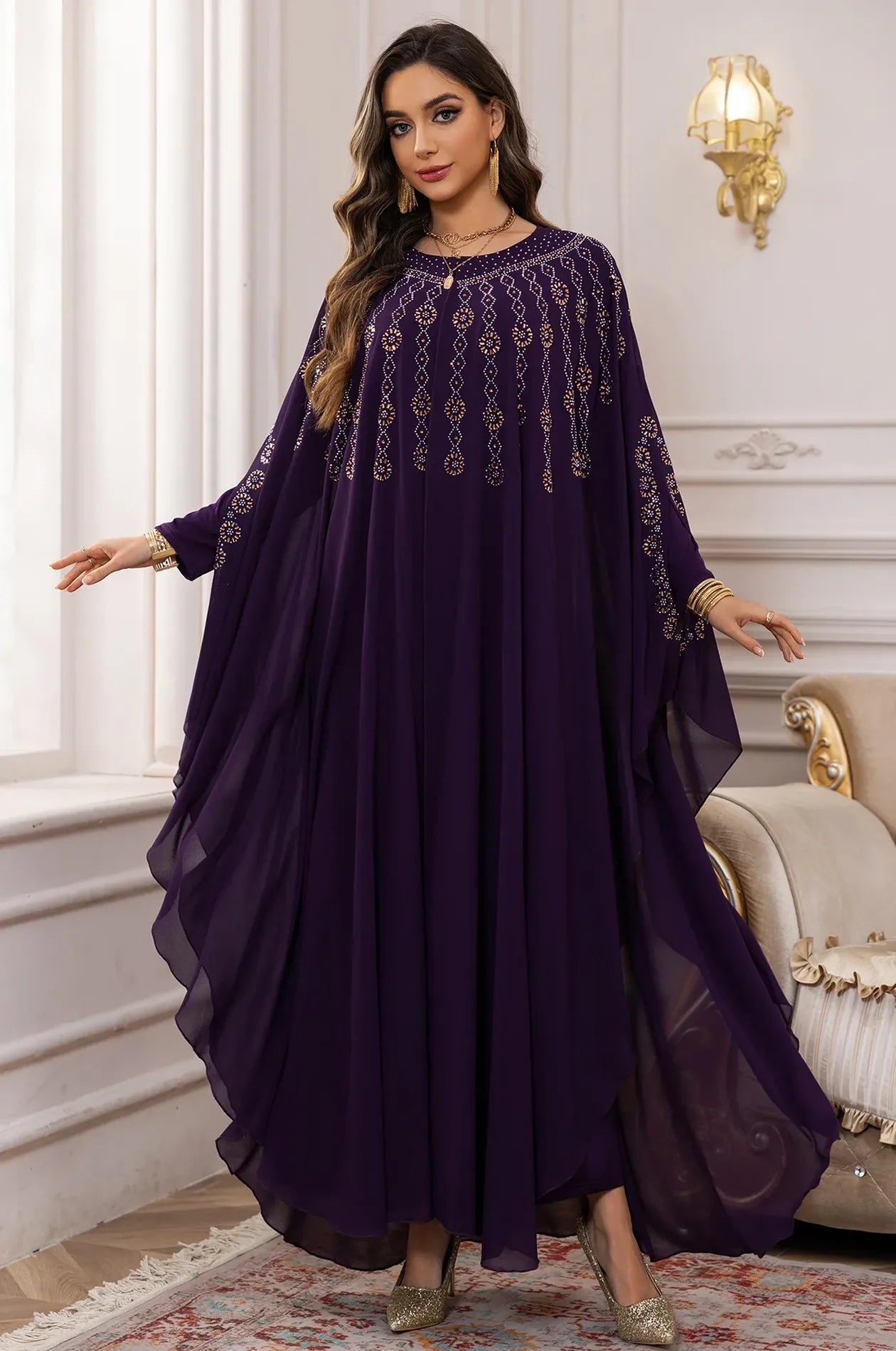 The Purple Cassia Kaftan displayed with arms extended to show the dramatic butterfly wing silhouette.