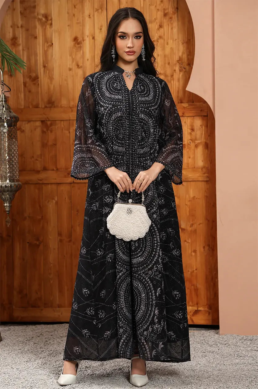 Elegant front pose of the Kaly Black sheer maxi kaftan by Naylara, perfect for high-end resortwear styling.