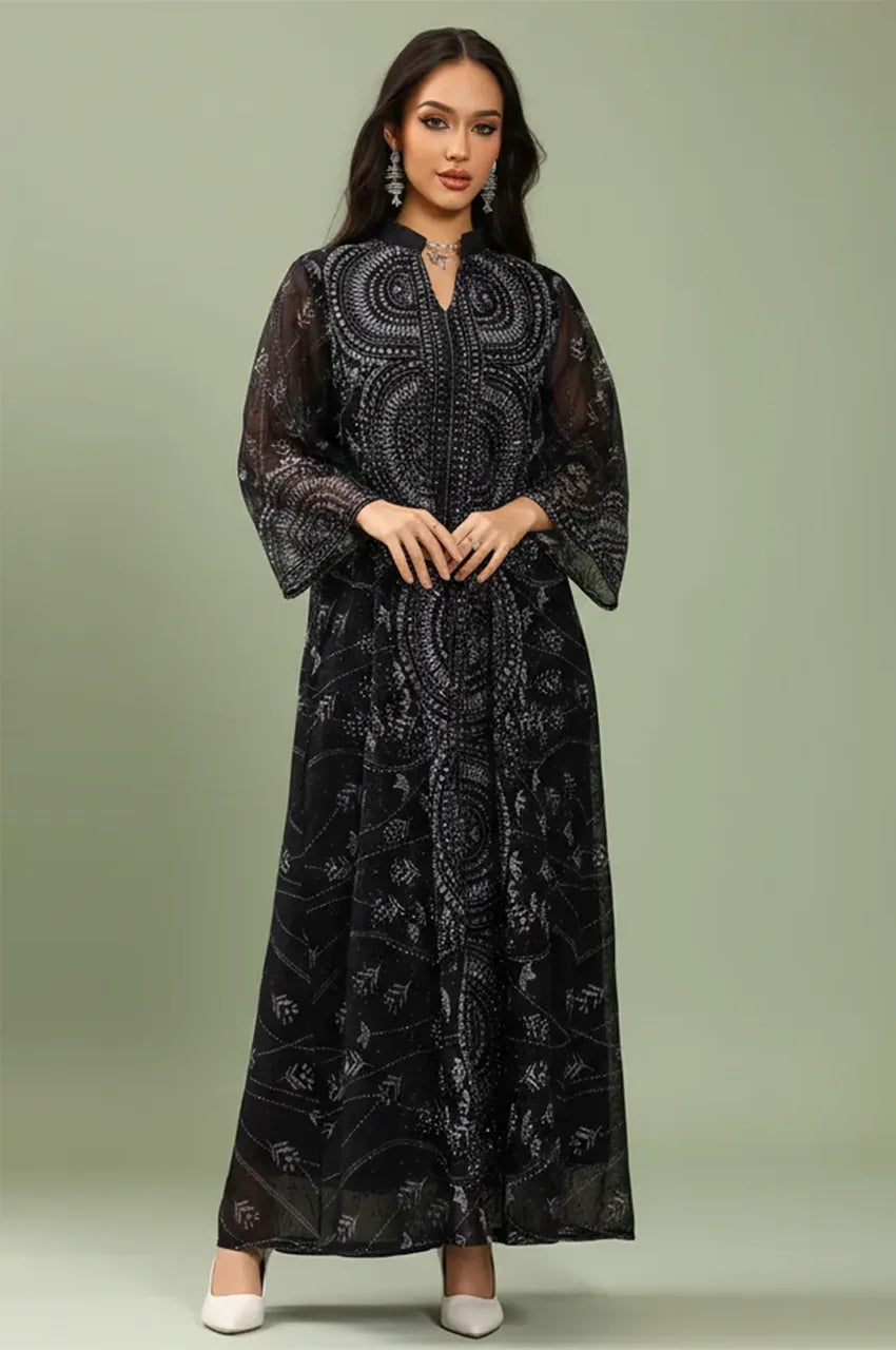 Studio shot of the Kaly Black sheer maxi kaftan showcasing the lightweight georgette fabric and wide flared sleeves.