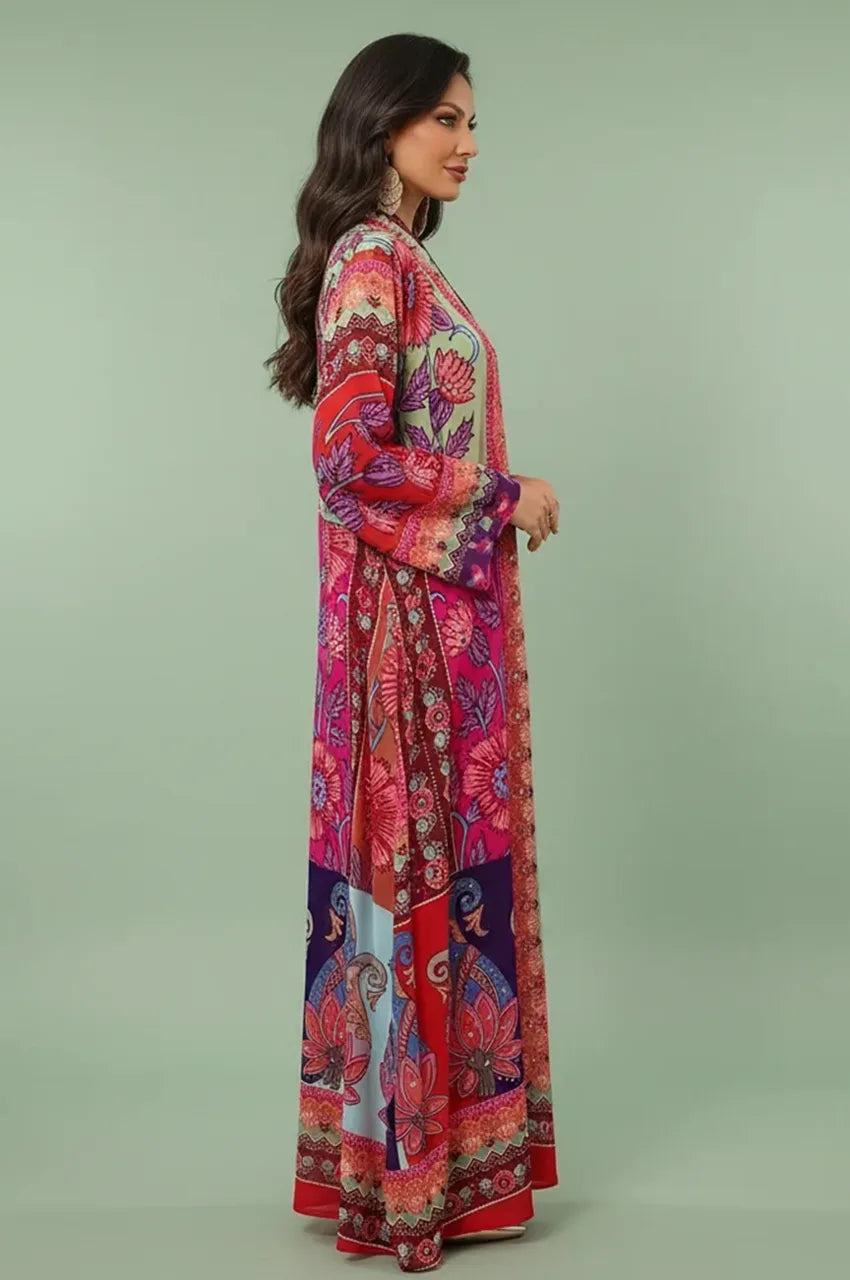 Side profile of the Kimia Indian kaftan night dress in orange from Naylara, demonstrating the fluid drape and modest resort wear fit.