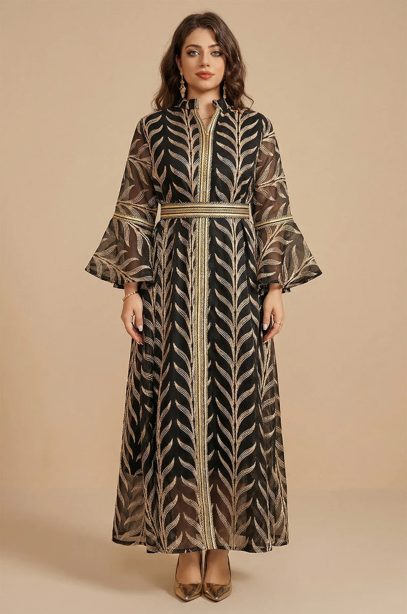 Full-length front view of the Kitala Elegant Moroccan Kaftan in black featuring metallic gold leaf embroidery and ruffled bell sleeves on a neutral background.