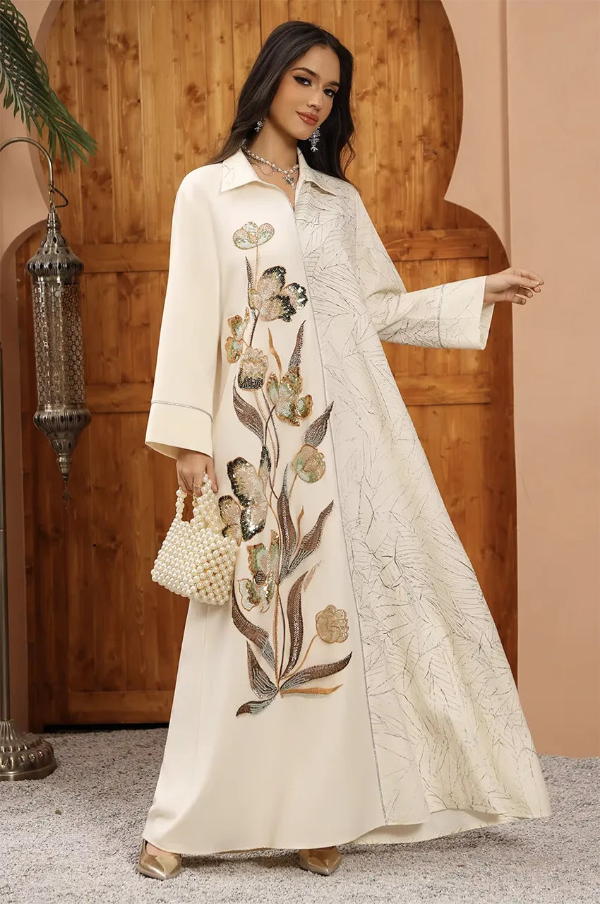 Styled front view of the Lamiya beige a line kaftan dress with ivory canvas and hand-applied sequin accents for a couture finish.