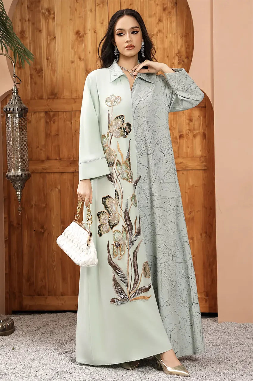 Modest Lamiya Green a line kaftan dress showcasing the graphic contrast between the sage base and the intricate leaf-motif panel.