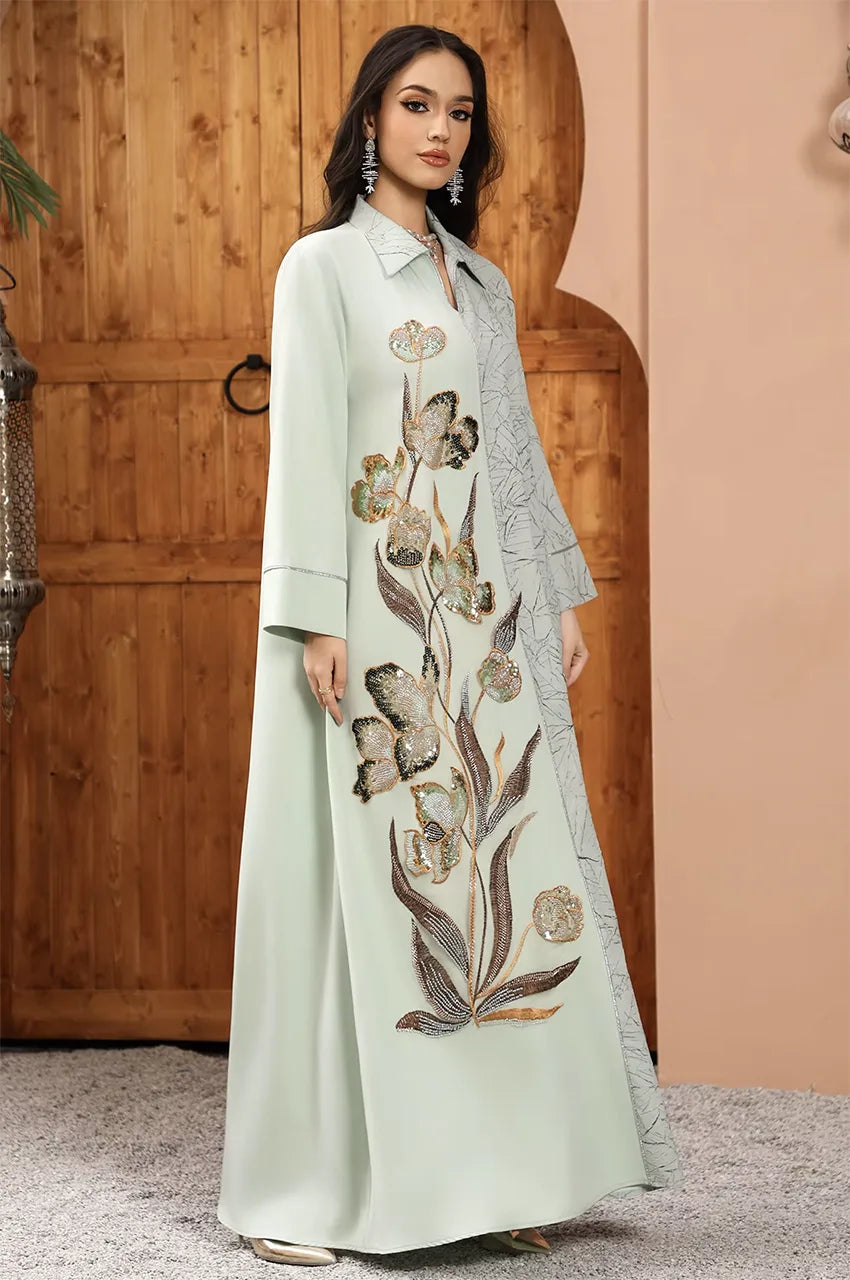 Full-length front view of the Lamiya Sage Green a line kaftan dress featuring 3D floral sequined embroidery and metallic sfifa braided trim.