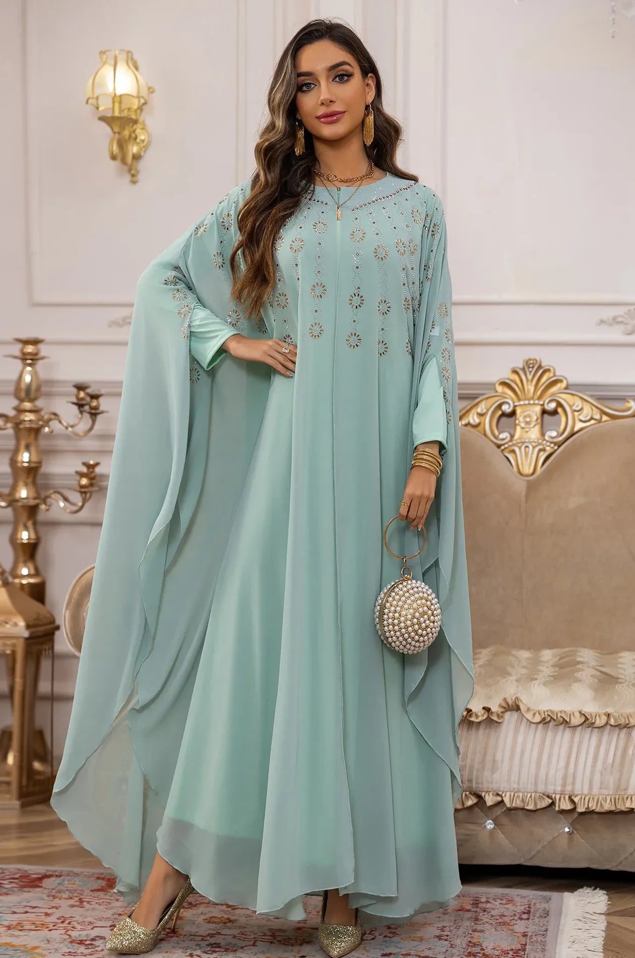 Full-length view of the Light Green Cassia Butterfly Rhinestone Kaftan in a luxury interior setting.