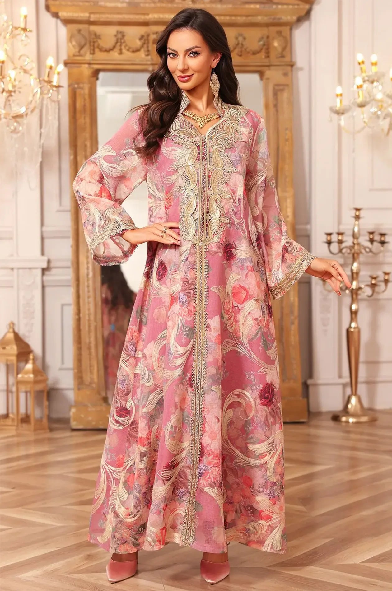 Model posing in the pink Lyrae floral kaftan within a luxury interior, emphasizing the high-fashion vintage aesthetic.
