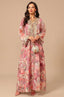 Full-length front view of the Naylara Lyrae pink vintage embroidered kaftan with rose floral print and a pearl-beaded circular handbag.