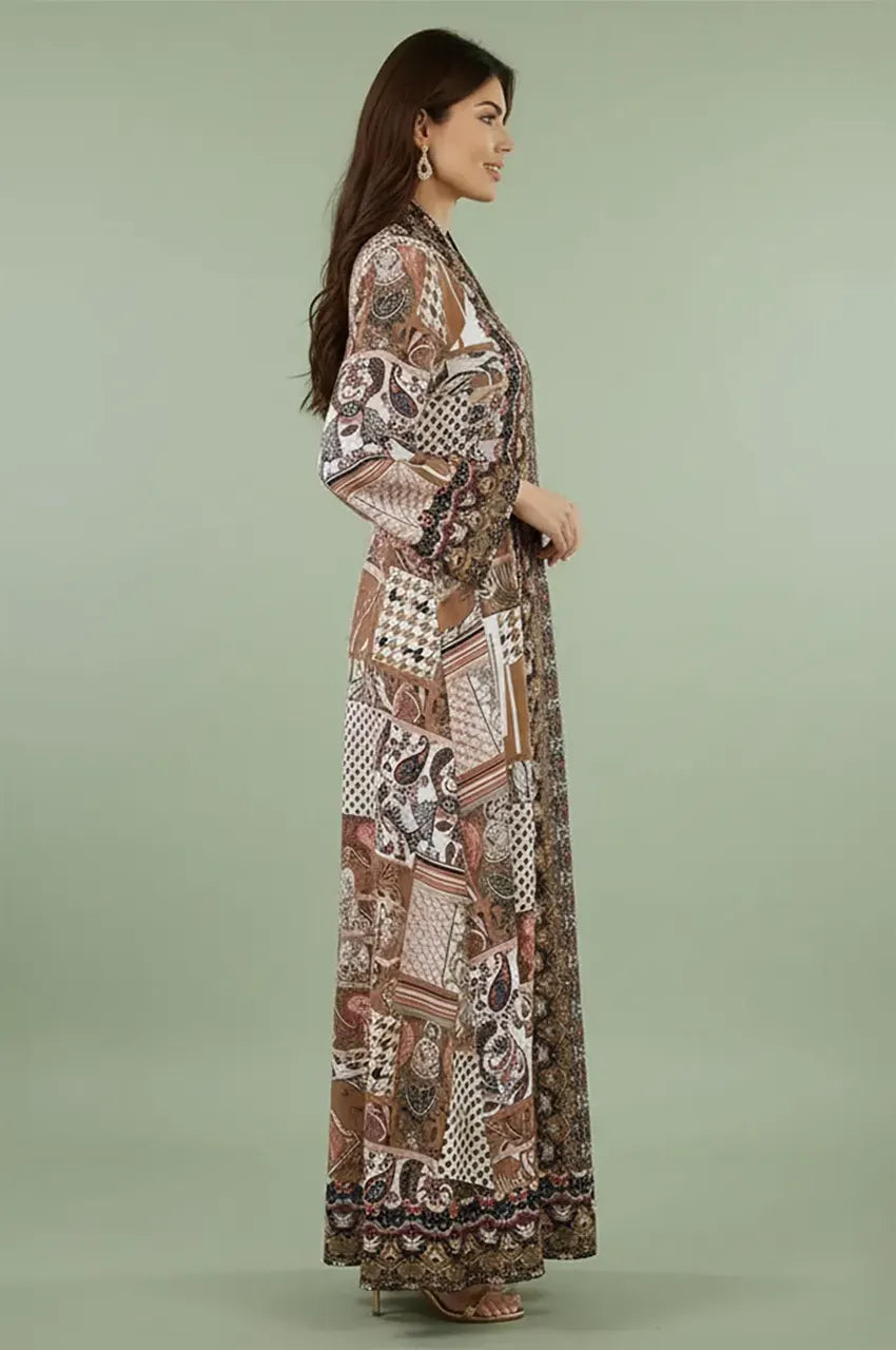 Side profile of the Nalah block print kaftan showing the fluid drape and green patterns.