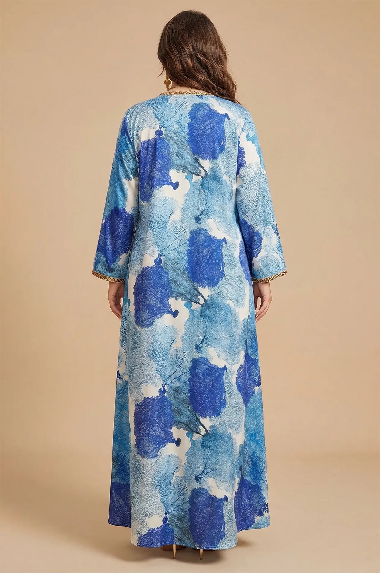 Back view of the Navae blue tropical print kaftan showing the elegant floor-length drape.