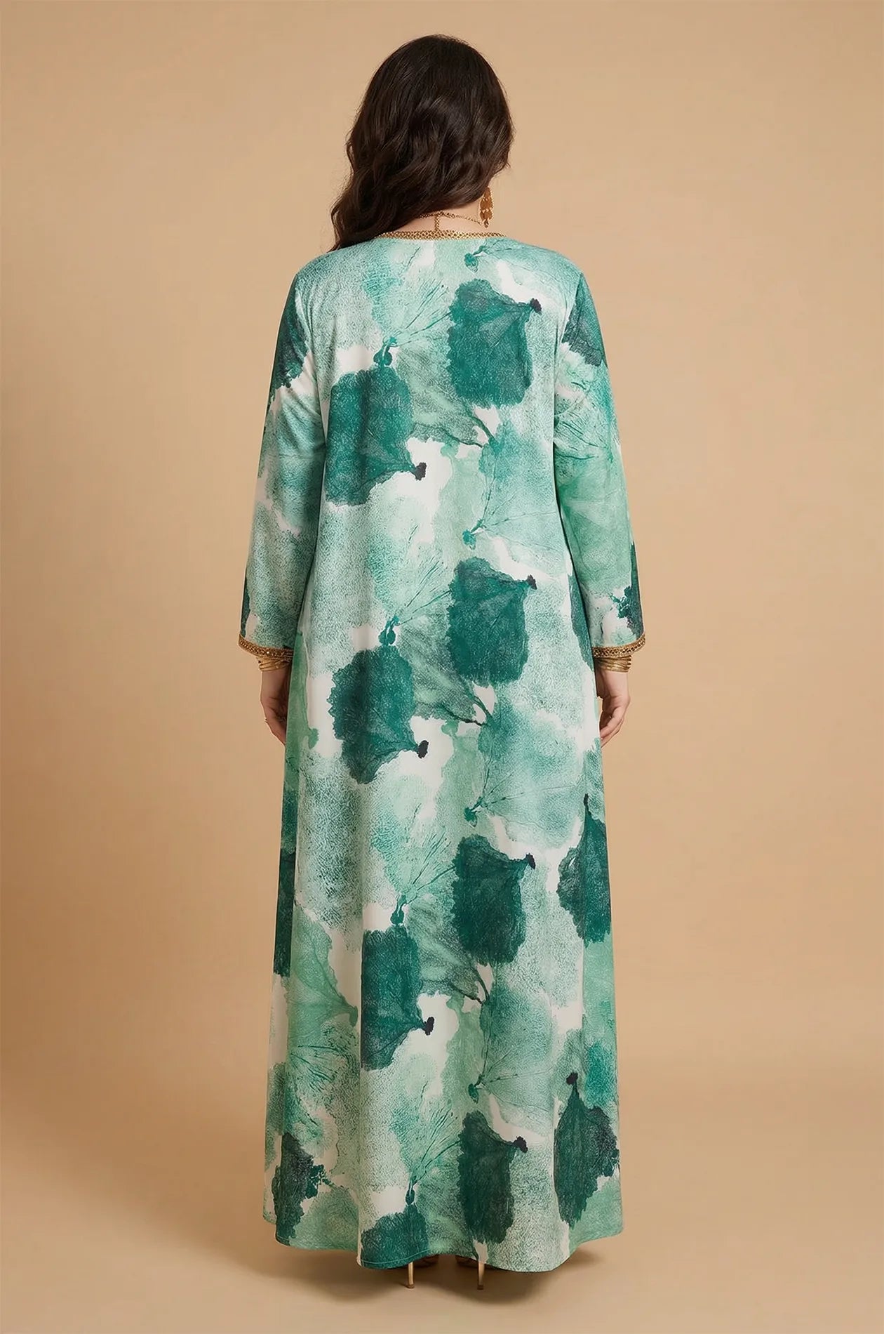 Back view of the Navae green tropical print kaftan showcasing the seamless botanical pattern and floor-length cut.