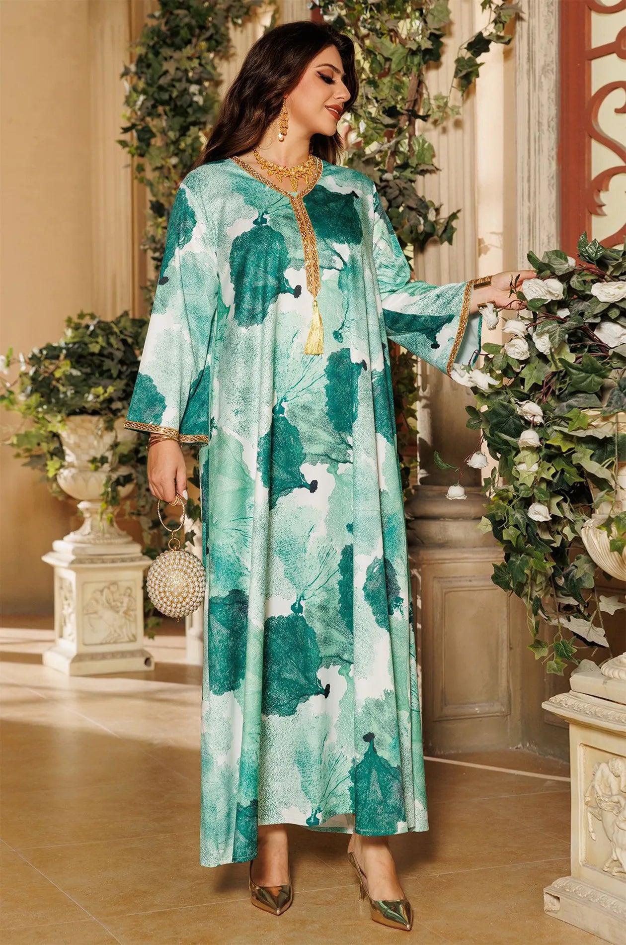 Elegant full-length pose of the green Navae tropical print kaftan showcasing the fluid movement of the lightweight fabric.