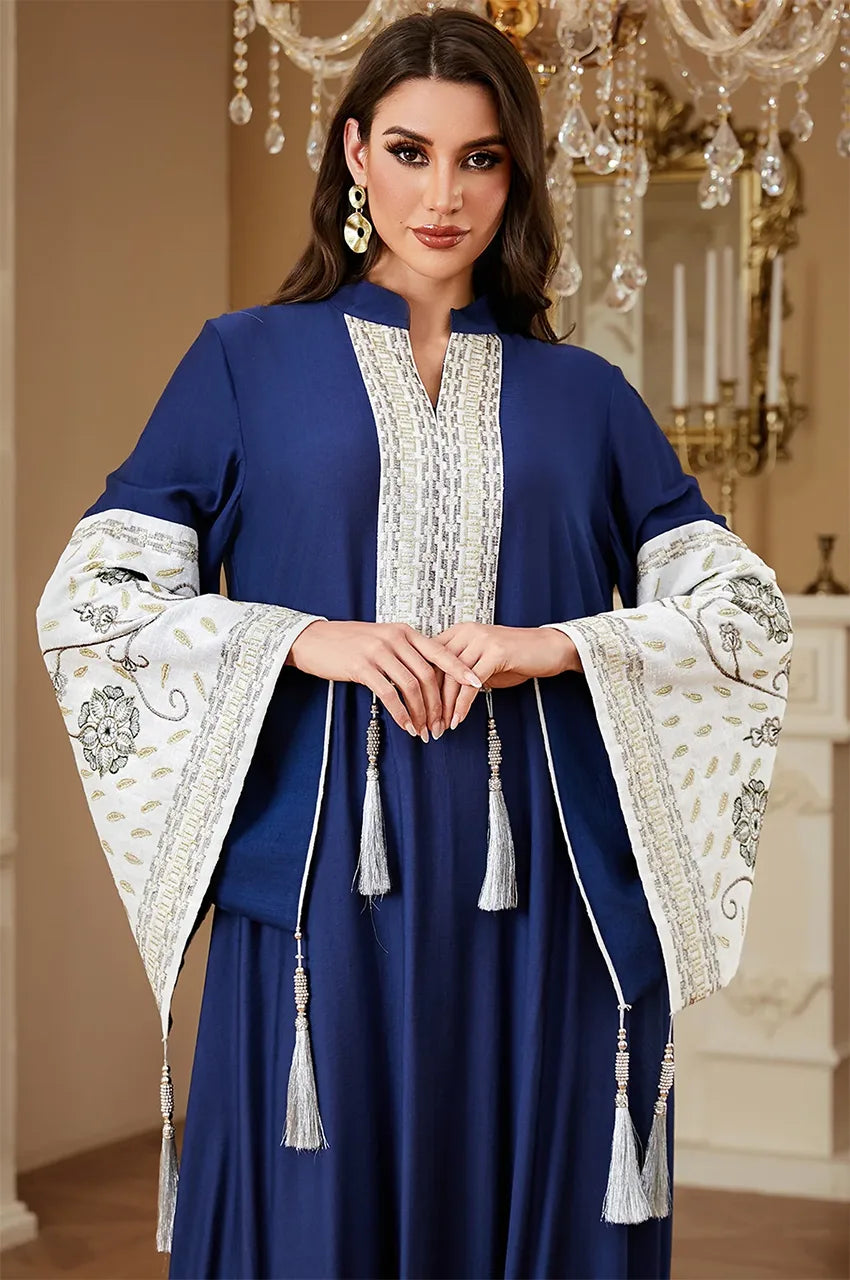 Close-up of the intricate white Sfifa embroidery and tassel details on the Navy Blue Nairi cotton kaftan maxi by Naylara