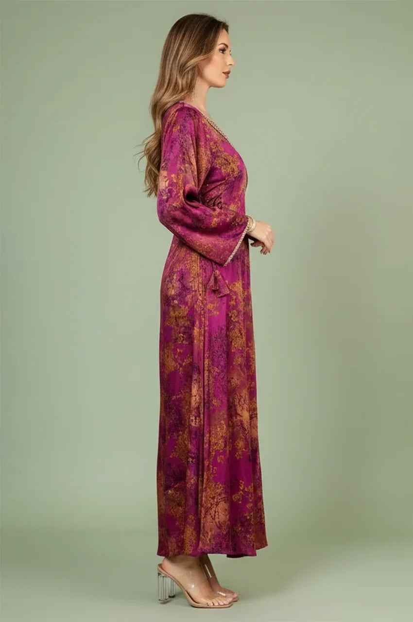 Side profile of the fuchsia red fitted kaftan showing the elegant sleeve drape and floor-length silhouette.
