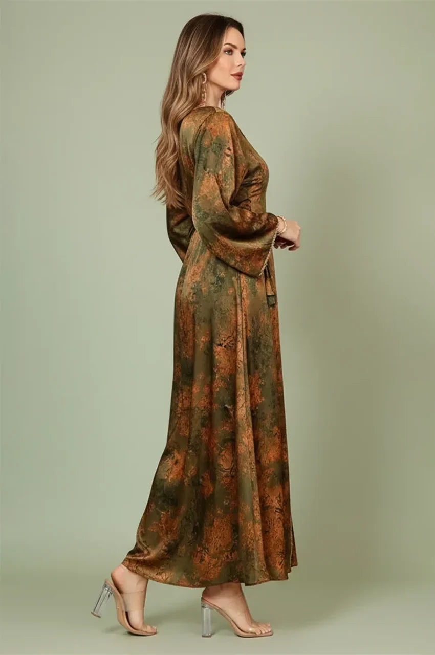 Side profile of the Noria olive green fitted kaftan showing the adjustable side lacing for a custom fitted waist
