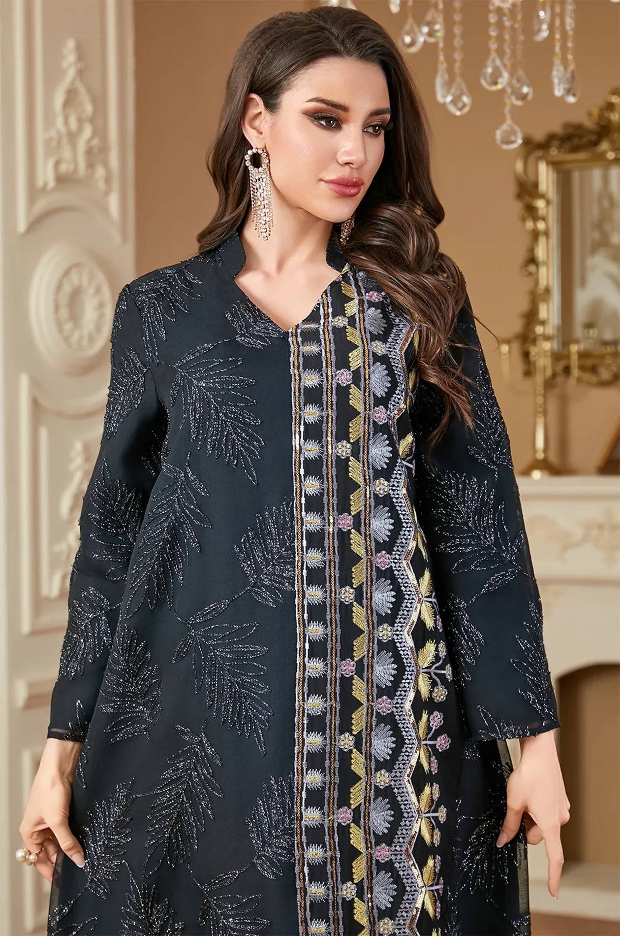 Close-up of the Saria black plus size sheer kaftan showing intricate silver leaf embroidery and a vertical beaded floral panel.