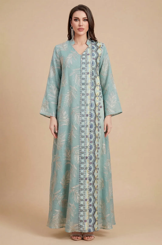 A full-length studio shot of the Saria gray sheer kaftan, an ideal evening gown for plus size silhouettes.