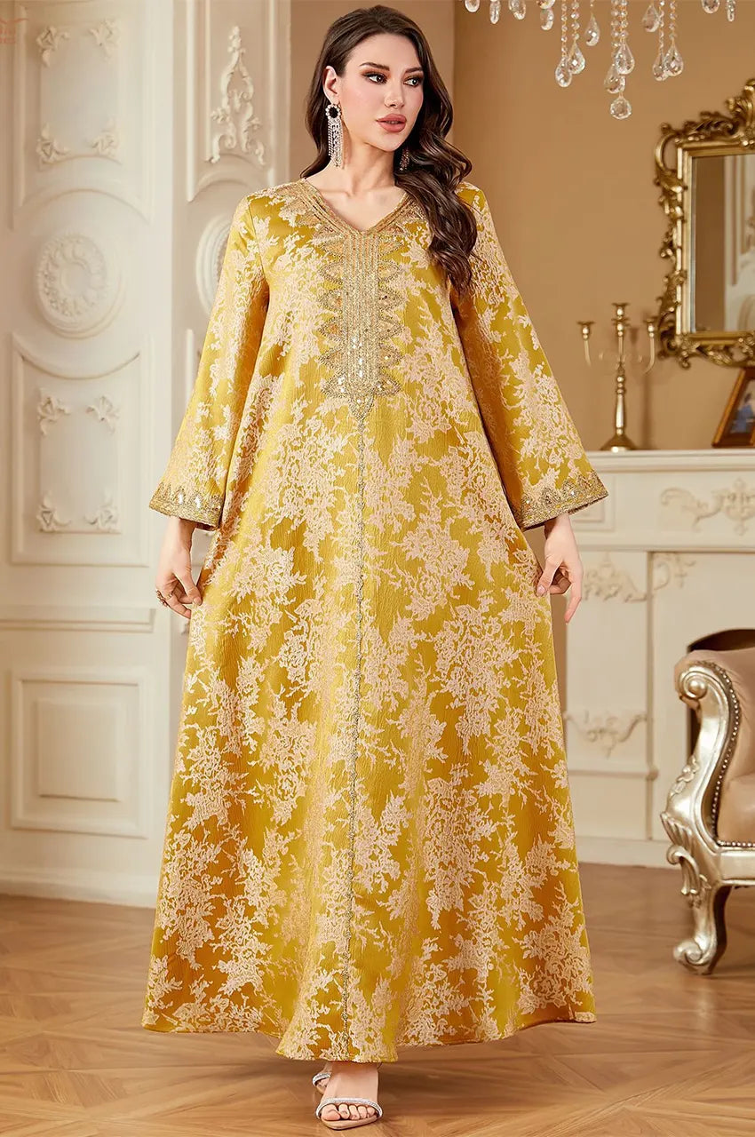 Front view of Zafra kaftan featuring premium jacquard fabric and intricate gold embroidery.