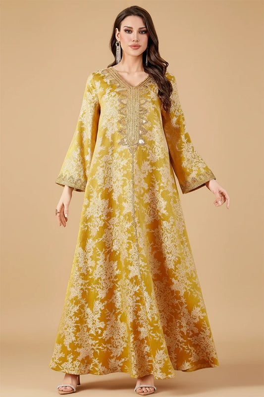 Full body shot of Zafra mustard yellow kaftan with sequin neckline for wedding guests.