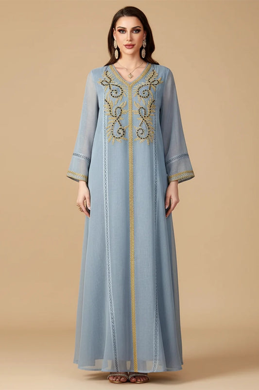Full-length Zaliya Gray modest evening dress with vertical piping and embroidered cuffs.