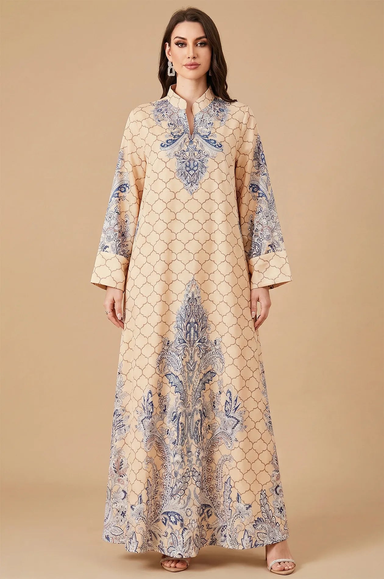 Full front studio shot of the Nirea beige paisley print kaftan, showcasing the symmetrical floral motifs and mandarin collar.
