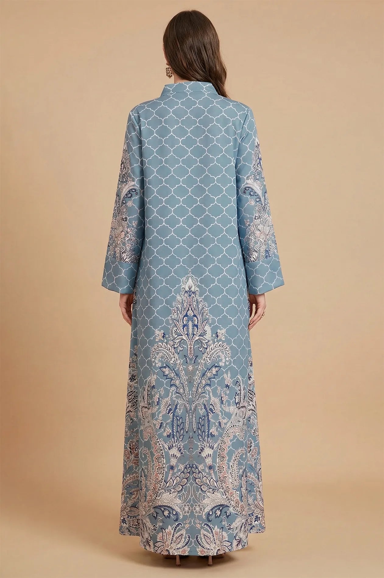 Full back view of the Nirea blue paisley print kaftan, highlighting the symmetrical ornamental arabesque design on the hem.