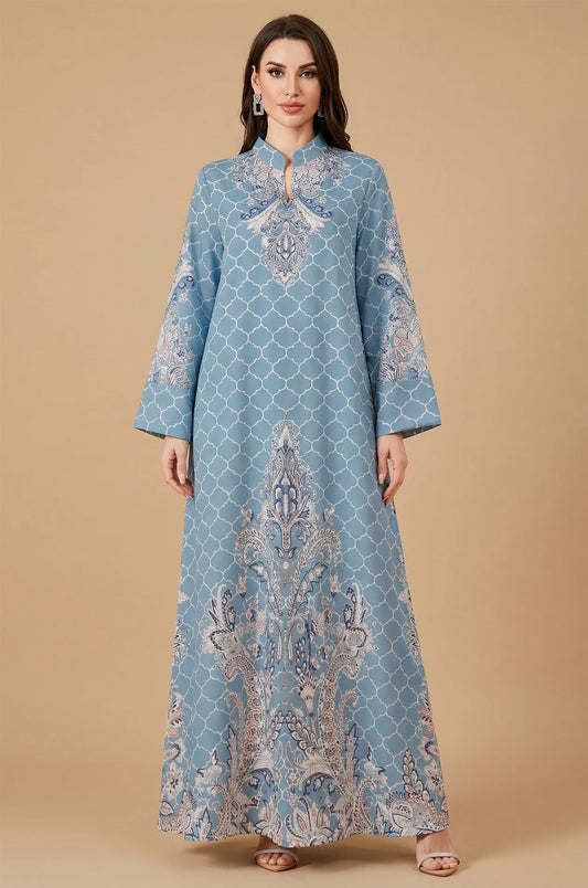 Professional studio shot of the Nirea blue paisley print kaftan, displaying the vibrant azure color and symmetrical floral patterns.