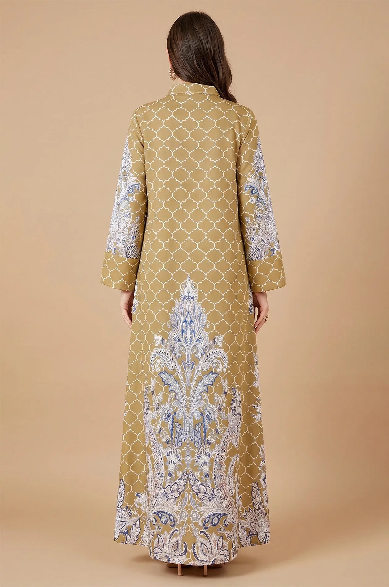 Back view of the Nirea mustard yellow kaftan highlighting the symmetrical arabesque and blue paisley print patterns.
