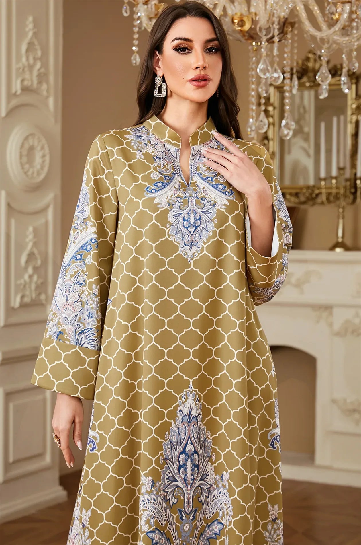 Close-up detail of the Nirea yellow kaftan focusing on the mandarin V-neckline and high-definition paisley print texture.