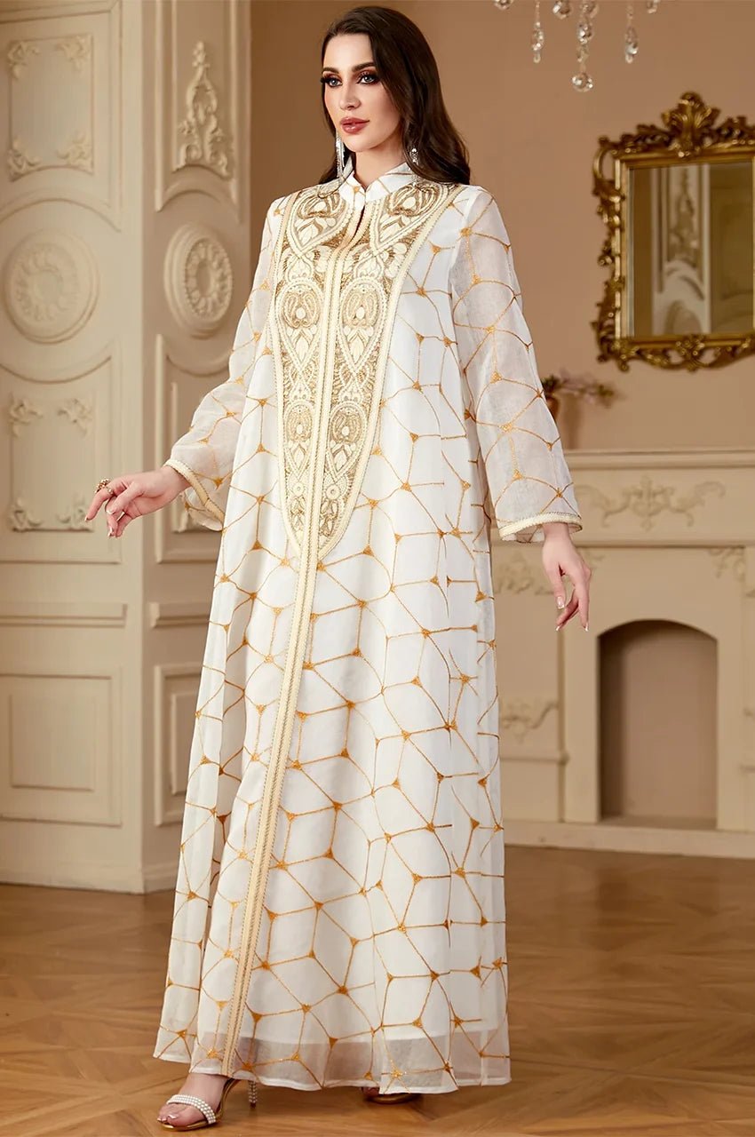 Detailed view of Rahel kaftan showing gold floral plastron embroidery and mandarin collar.