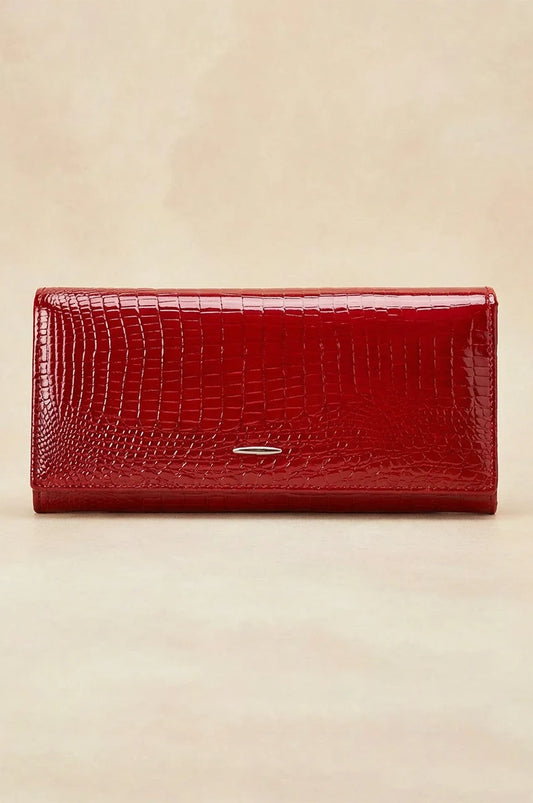Front view of the red crocodile embossed patent leather long wallet with silver logo accent.