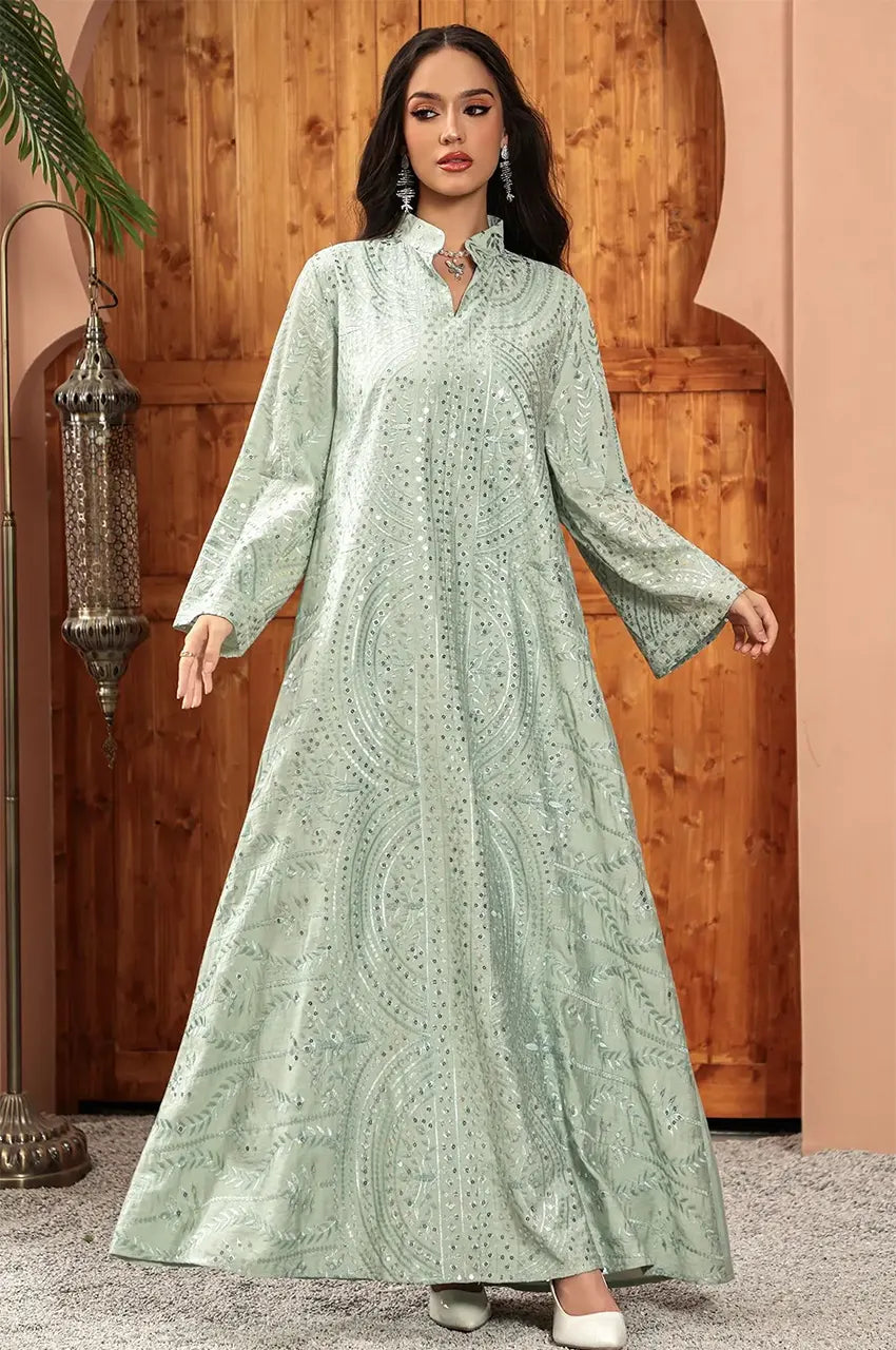 Full shot of the Maeli Kaftan illustrating the elegant movement of its wide bell sleeves.