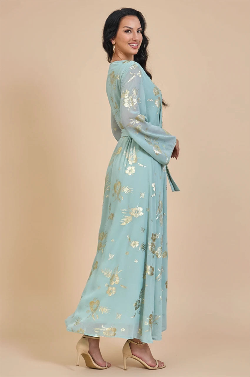 Side profile view of the Malika kaftan dress highlighting the sheer sleeves and A-line silhouette.