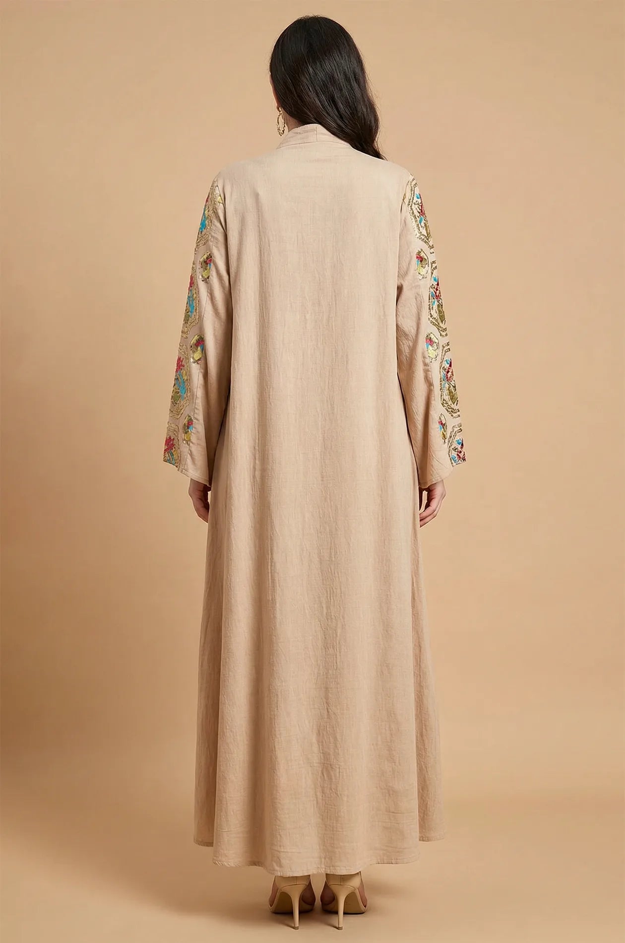 Back view of the Sorin beige mandarin collar kaftan showing the floor-length drape and embroidered sleeve borders.