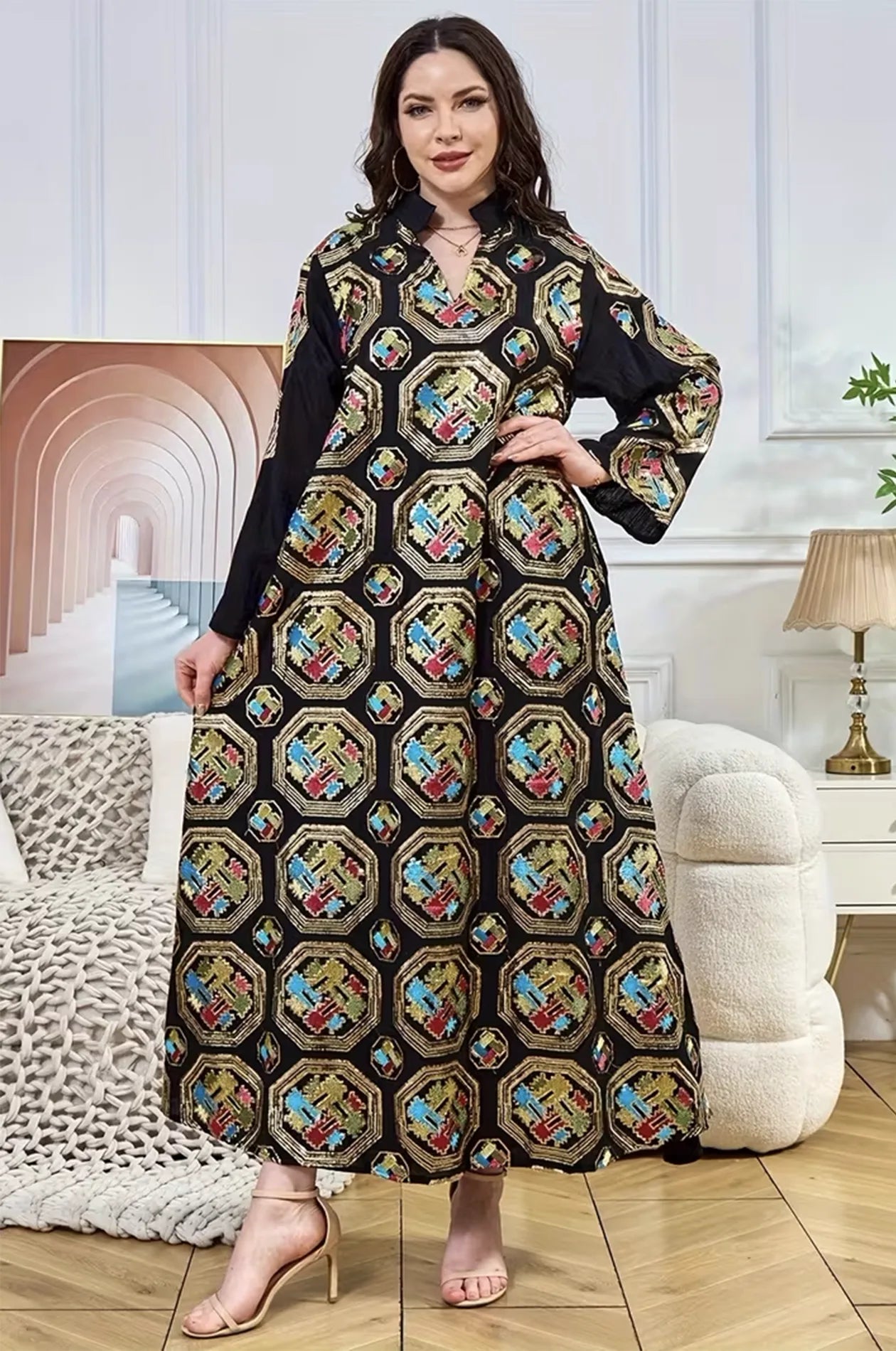 Full-length view of the black Sorin sequin kaftan by Naylara, showcasing the flowing fabric and traditional mandarin collar.