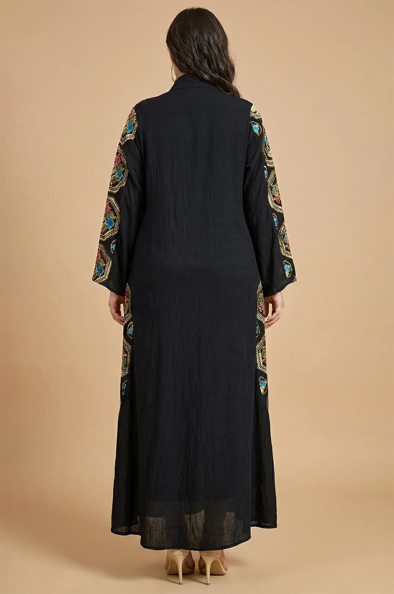 Back studio view of the Sorin black kaftan highlighting the modest mandarin collar and embroidered sleeve borders.