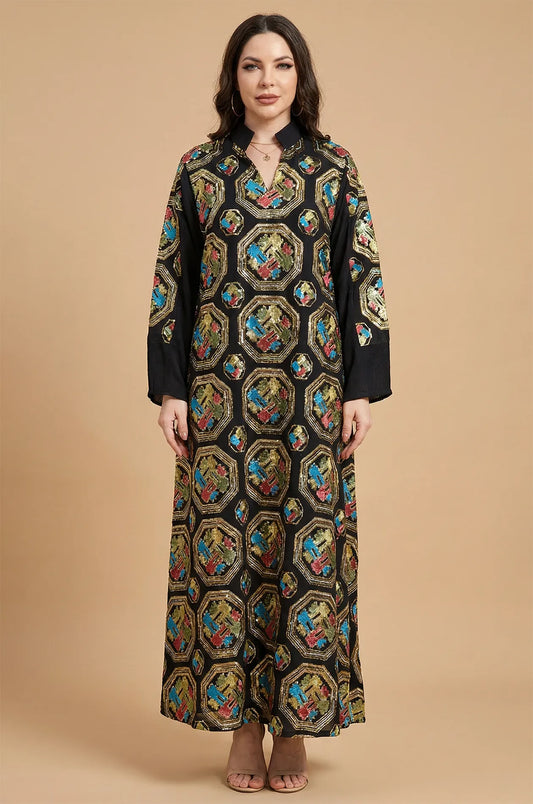 Front studio portrait of the Sorin black mandarin collar kaftan, displaying the all-over ornate sequin embellishments.