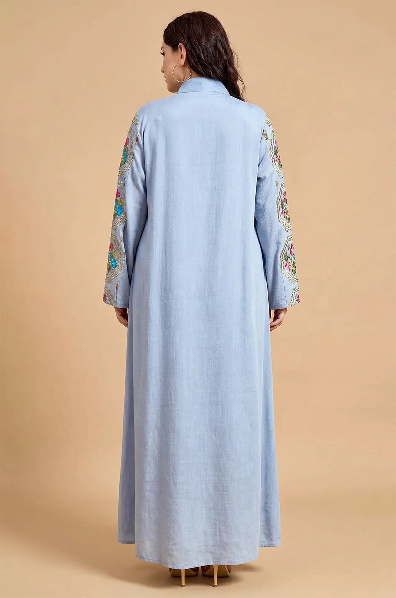 Back view of the Sorin light blue mandarin collar kaftan showing the elegant drape and sleeve embroidery.