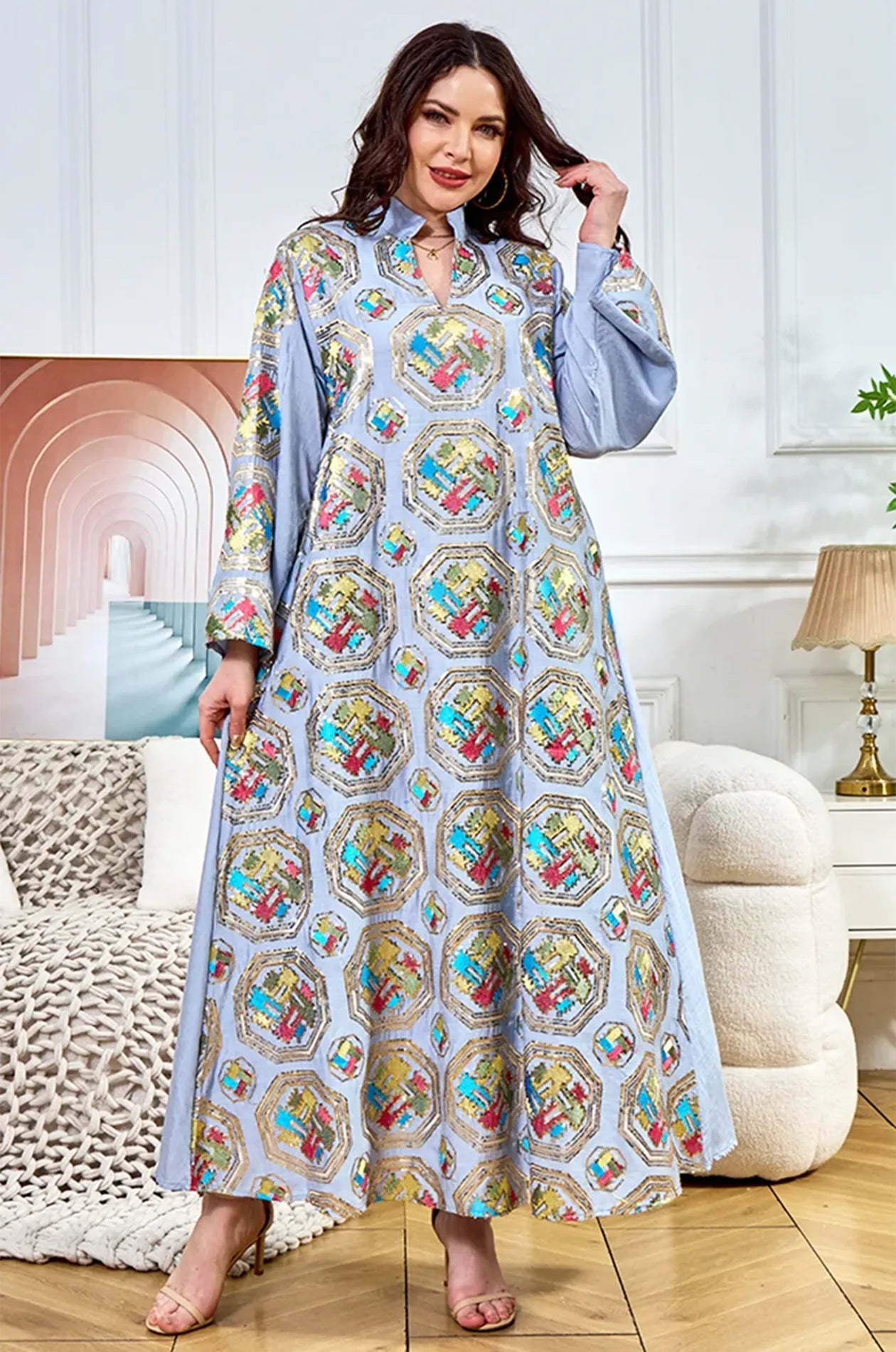 Model posing in the Sorin light blue mandarin collar kaftan, highlighting the vibrant thread-work and shimmering sequins.