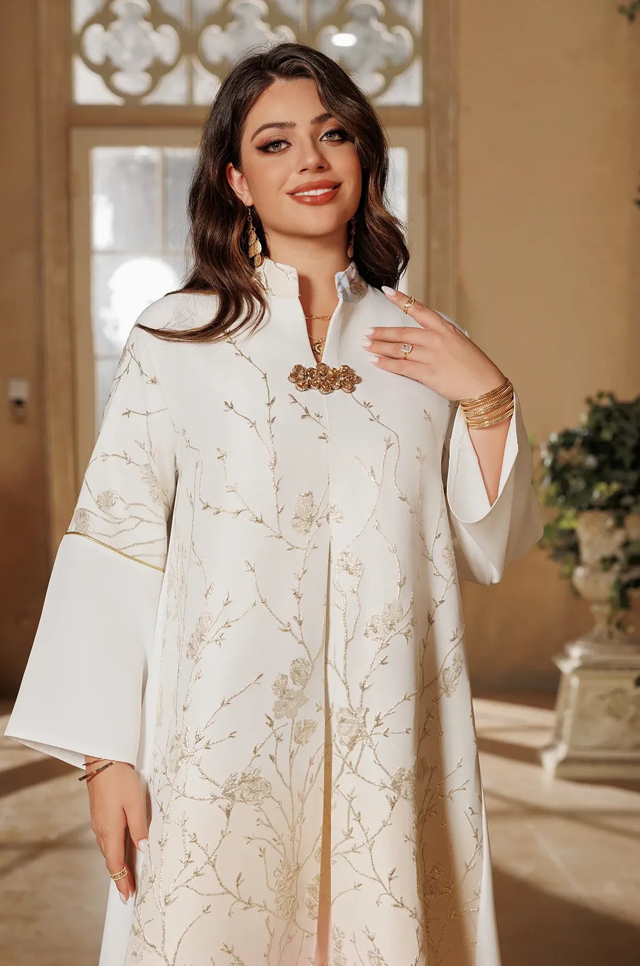 A portrait-style shot of the Tayla Light Blue Botanical Kaftan focusing on the mandarin collar and floral embellishment at the neckline.